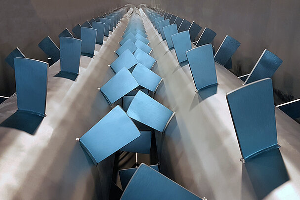 Mixing paddles inside a mixing screw conveyor